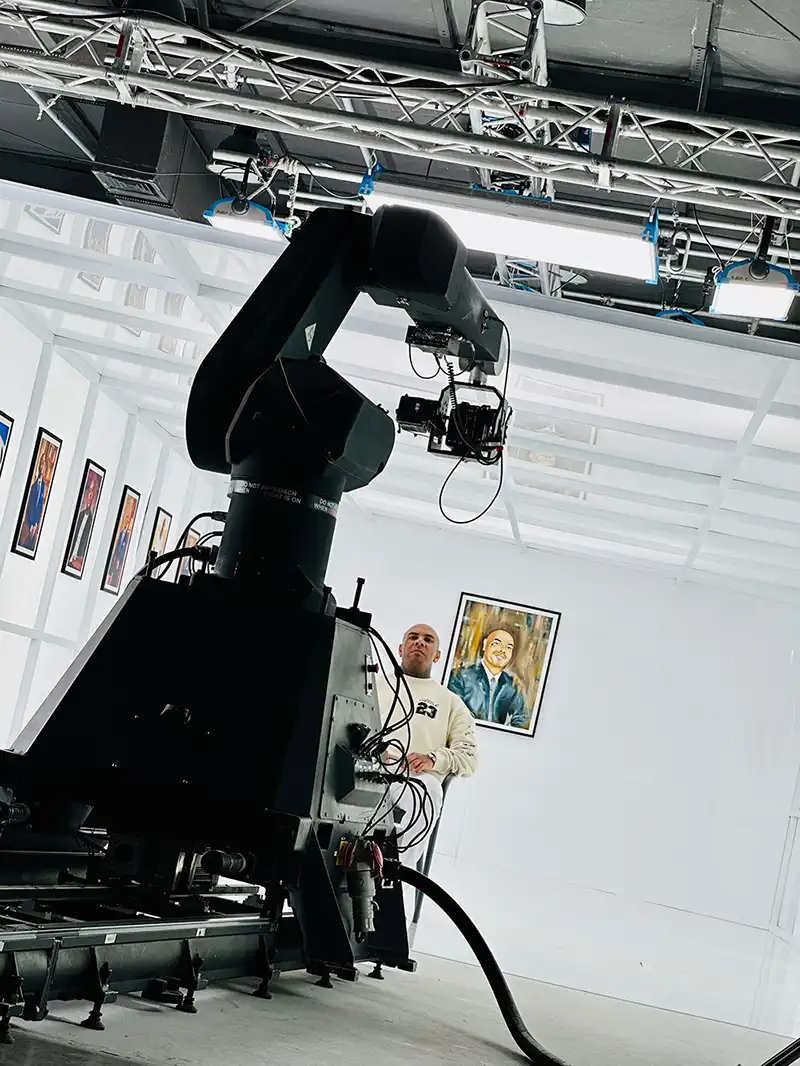 Karim Gharbi on a film set next to a camera crane